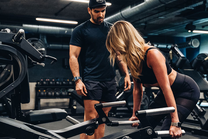 Trainer coaching a client